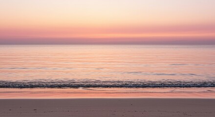 Fototapeta premium Gentle Beach Wave at Sunset with Pastel Sky and Calm Water