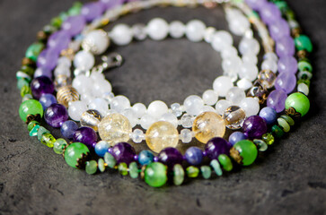 necklace of natural stones on the background of gem stones