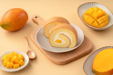 Delicious mango cream Swiss roll cake on plate
