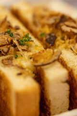 Half toast with beef ribs and onions close up