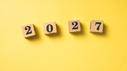 Wooden blocks with black numbers forming 