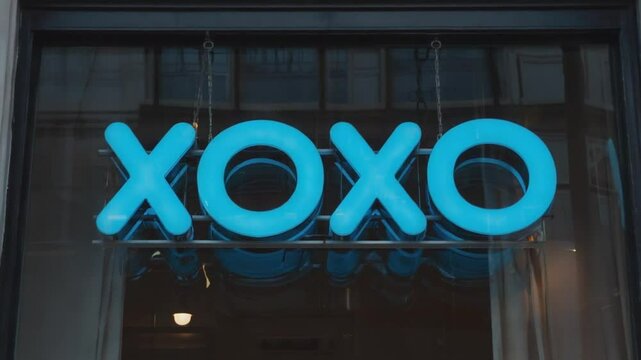 Neon sign with the text XOXO.