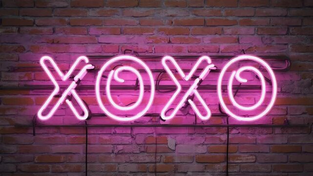 Neon sign with the text XOXO.