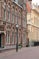 Fototapeta premium Grote Oost Street View with Old Building Facades and Lamp Post in Hoorn, Netherlands