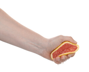 Woman squeezing grapefruit on white background, closeup