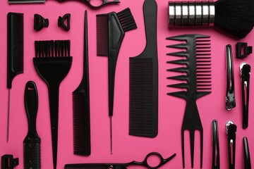 Different hairdresser's tools on pink background, flat lay