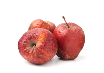 Many whole rotten apples isolated on white