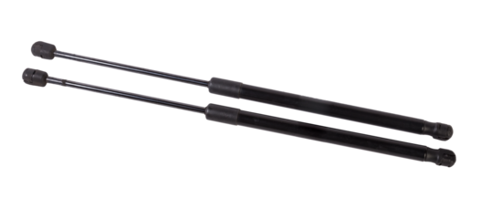 A pair of black metal hood shock absorbers with chrome elements - detail of a car mechanism on a white isolated background. Spare parts for body repair.