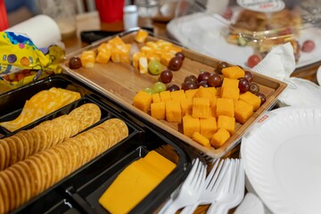 Cheese and cracker platter with grapes.