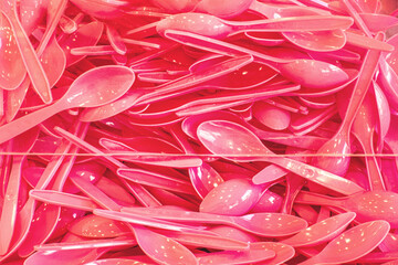 Pink plastic spoons
