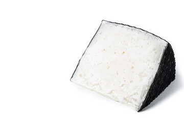 Close-up of a wedge of semi-cured cow's cheese isolated on white background