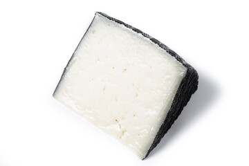 Close-up of a wedge of semi-cured cow's cheese isolated on white background