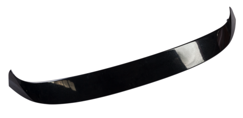 Black plastic spoiler for installation on the trunk lid of a car for tuning on a white isolated background in a photo studio at auto-analysis. Sporty design in the workshop