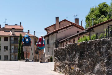 Pilgrim couple entering Villava, on the Way of St. James. Zubiri-Pamplona stage.
