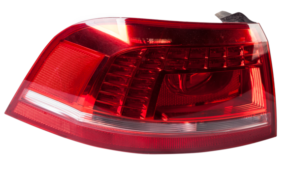 A taillight of a stop signal for a German auto - optical equipment of white and red color on a white isolated background. A spare part for repair and sale in a car service center.