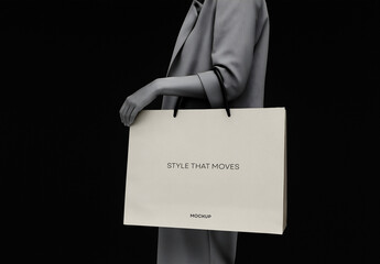 Minimal Paper Bag Mockup &ndash; Elegant Fashion Packaging with Black Background and Hand Holding Scene