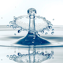 A stunning high-speed capture of a water droplet collision, forming an elegant crown-like splash