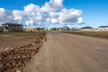An unpaved road in a newly developed residential estate in Wyndham Vale, Melbourne, Australia....
