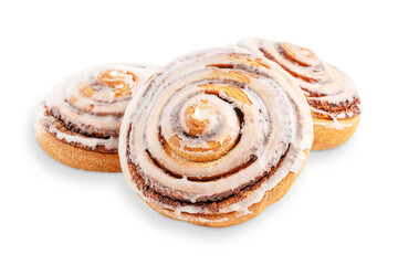 Three delicious homemade sweet cinnamon rolls bun or swirl glazed with sugar icing made of wheat...