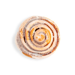 Top view of single delicious, freshly baked, sweet homemade cinnamon roll bun or swirl glazed with sugar icing isolated on white background served for morning breakfast as traditional dessert pastry