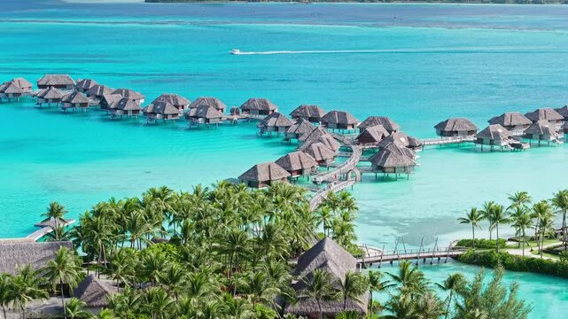 Bora Bora Island, French Polynesia. Aerial View of Overwater Bungalows of Luxury Tropical Resort and Turquoise Lagoon Water