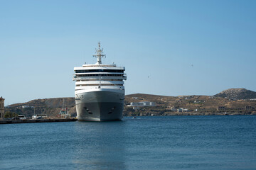 Cruise ship docked at Mediterranean port viewed from the front on a sunny clear day