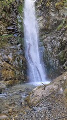 Obraz premium Peaceful Moments by a Thundering Waterfall