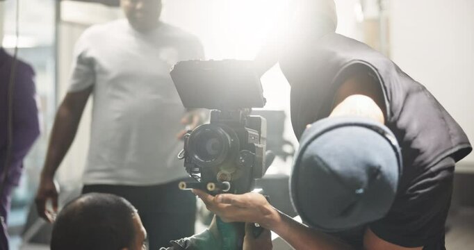 Film, setup and men with camera on set for shooting, check lighting and equipment settings. Cinematography, behind the scenes and people in studio for videography, media production and filmmaking