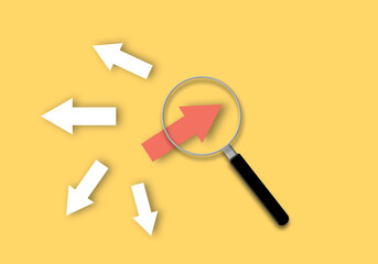 Magnifier focuses with red arrow on yellow background as metaphor for business creativity new idea, finding new normal way, individual and unique leader. Achievement. copy space. paper cut design.