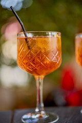 a glass of a cocktail with selective focus and blurred background