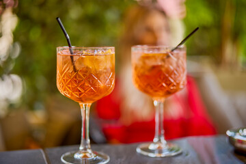 a glass of a cocktail with selective focus and blurred background