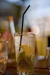 a glass of a cocktail with selective focus and blurred background