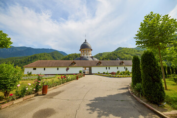 image from the outside of a church in Romania with paintings specific to the area and the Orthodox...