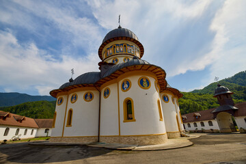 image from the outside of a church in Romania with paintings specific to the area and the Orthodox...