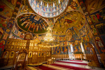 image from inside a church in Romania with paintings specific to the area and the Orthodox religion