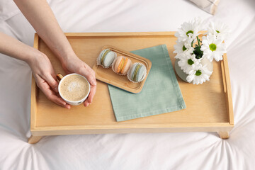 Woman having delicious breakfast in bed, closeup