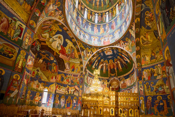image from inside a church in Romania with paintings specific to the area and the Orthodox religion