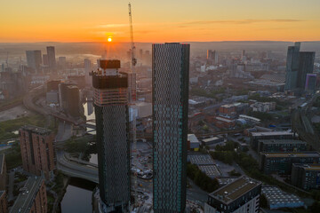 Aerial image of a golden sunrise over Manchester cityscape  with River Irwell on the view 