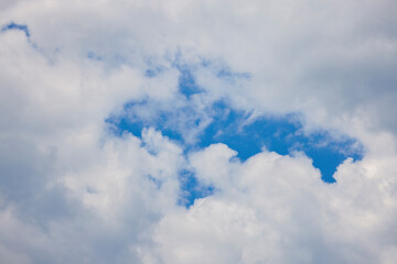 landscape with part of the blue sky seen through the clouds