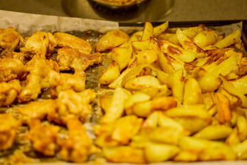 chicken wings with tomato and paprika sauce and potatoes