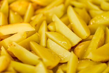 potatoes cut and cooked in the oven with onion and cheese