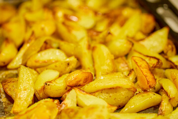 potatoes cut and cooked in the oven with onion and cheese