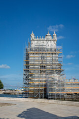 The Belem Tower in Lisbon, Portugal, undergoing restoration in June 2025, surrounded by scaffolding to preserve its iconic Manueline architecture for future generations.