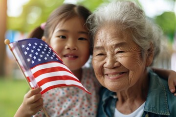 Granddaughter holding american flag celebrating with grandmother