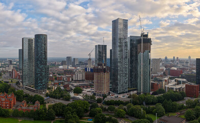 Panoramic aerial image of Manchester skyline featuring New Jackson St high-rises and Mancunian way. 