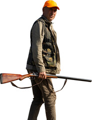 Mature man hunter with gun while walking on field.