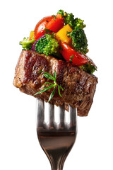 A grilled steak, topped with colorful roasted vegetables, sits on a fork