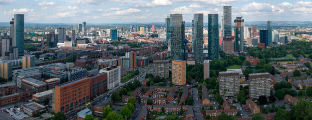 Panoramic aerial image of the cloudy Manchester cityscape 