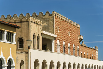 patterned brick facade facing the harbor of South Aegean Region Government Building, Platia...