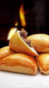 Esfiha, also known as sfihah in Arabic, is a small baked pie originating from the Middle East, especially Syria and Lebanon.